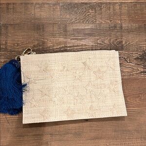Straw Clutch with Tonal Star Details and a Blue Tassel